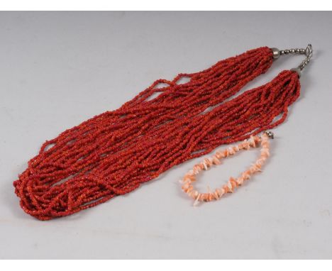 A twenty-strand necklace of 2.5mm coral beads and a modern stick coral bracelet 