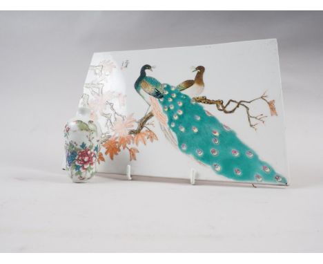 A Chinese Republic tile, decorated peacocks on a branch, 10" wide x 7" high, and a famille verte scent bottle, decorated bird