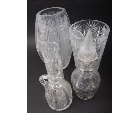 A 19th century cut glass decanter with spearpoint top, a cut glass liqueur decanter and stopper, and three cut glass vases, v