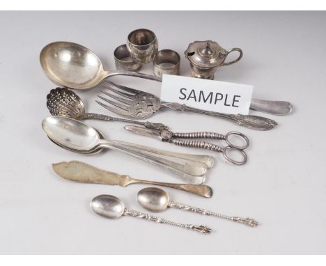 A quantity of silver plate, including a ladle, rattail spoons, three napkin rings, grape scissors and other items 