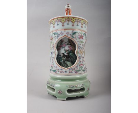 A Chinese famille rose three-section reticulated and rotating pot and cover, decorated birds, with birds and Dog of Fo finial