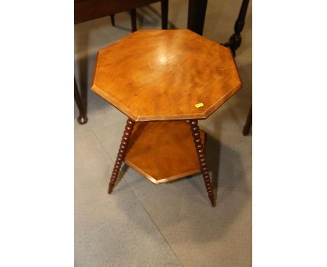 A walnut octagonal and hexagonal two-tier occasional table, on bobbin turned supports, 19" wide x 25" high 