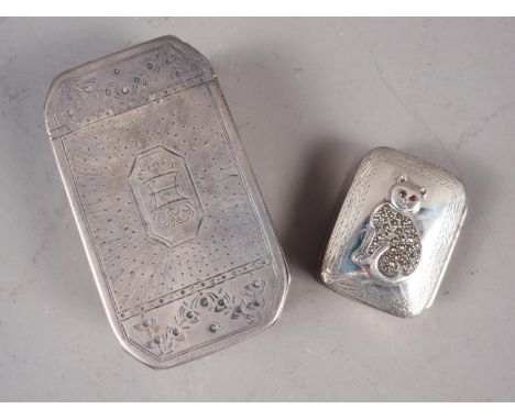 A silver octagonal snuff box with engraved decoration and a white metal pill box with applied cat decoration inset marcasites