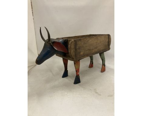 A BULL BRICK MOULD WOOD AND METAL PLANTER