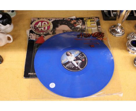 AN ELVIS DOUBLE LP LIMITED EDITION ON PINK VINYL AND AN ANDY GIBB 12" BLUE VINYL RECORD