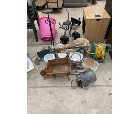 AN ASSORTMENT OF ITEMS TO INCLUDE CERAMIC PLANTERS, A GALVANISED WATERING CAN AND A HOSE REEL ETC