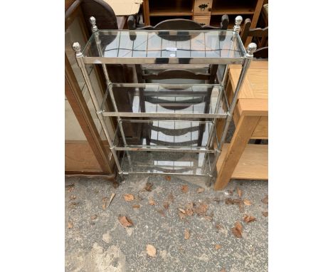 A FOUR TIER OPEN DISPLAY SHELF UNIT WITH GLASS SHELVES AND POLISHED CHROME FRAME, 24" WIDE