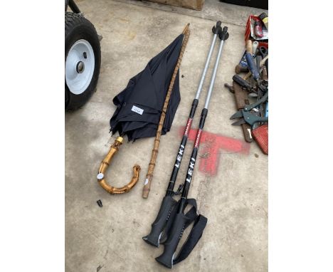 A PAIR OF LEKI WALKING POLES, AN UMBRELLA AND A WALKING STICK ETC