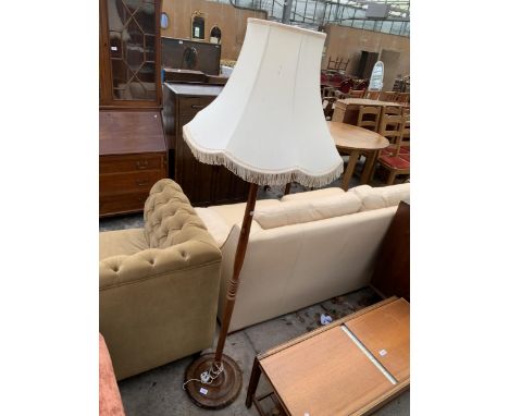 A STANDARD LAMP WITH TURNED COLUMN AND SHADE
