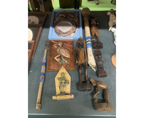 A COLLECTION OF AFRICAN STYLE ITEMS TO INCLUDE CARVED FIGURES, A CERAMIC MASK, ETC