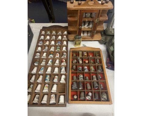 A LARGE QUANTITY OF THIMBLES IN WOODEN CASES CERAMIC AND WHITE METAL