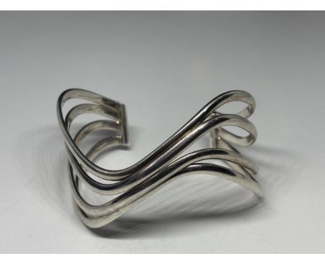 A MARKED SILVER BANGLE