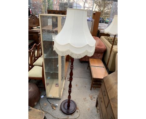 A STANDARD LAMP WITH TURNED COLUMN AND SHADE