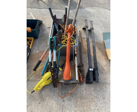 AN ASSORTMENT OF GARDEN TOOLS TO INCLUDE A FLYMO STRIMMER, A CHALLENGE ELECTRIC HEDGE TRIMMER AND SHEARS ETC