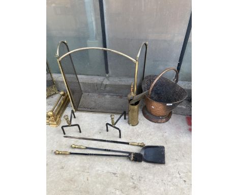 AN ASSORTMENT OF FIRESIDE ITEMS TO INCLUDE A FIRE SCREEN, FIRE DOGS AND A COPPER COAL BUCKET ETC