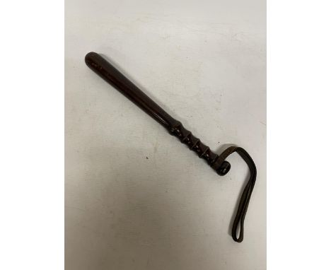 AN EARLY 20TH CENTURY SALFORD POLICE TRUNCHEON WITH LEATHER WRIST STRAP