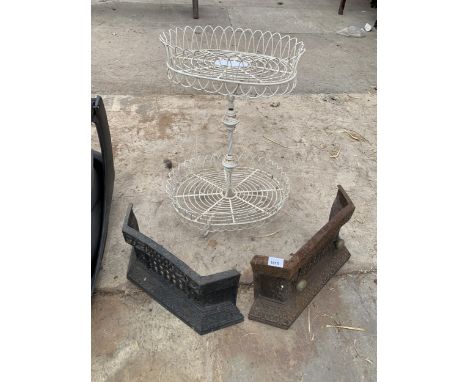 TWO DECORATIVE CAST FIRE FRONTS AND A METAL TWO TIER WIRE SHELF