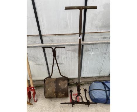 A VINTAGE HANDHELD CULTIVATOR AND A GARDEN ROLLER