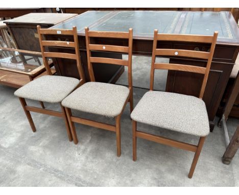 THREE RETRO TEAK LADDER BACK DINING CHAIRS