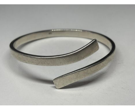 A MARKED SILVER BANGLE