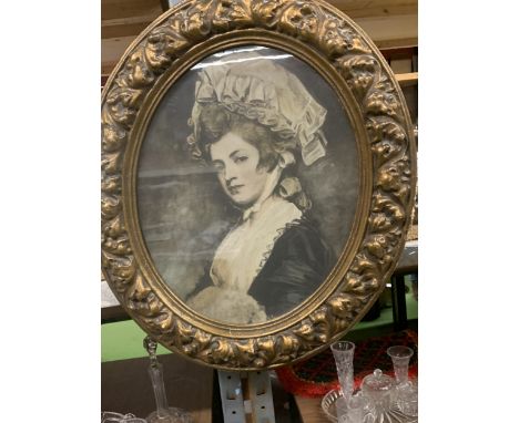 AN OVAL PORTRAIT PRINT OF A LADY IN A GILT FRAME