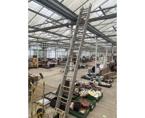 A TWENTY FOUR RUNG TWO SECTION ALUMINIUM EXTENDING LADDER