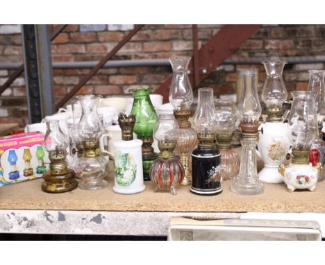 A COLLECTION OF MINI CERAMIC AND GLASS OIL LAMPS