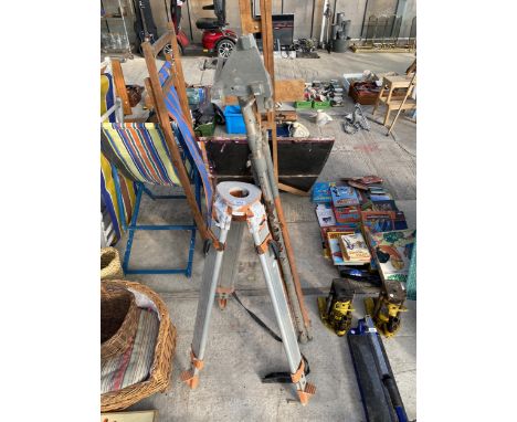A LAZER LEVEL STAFF AND TRIPOD STAND