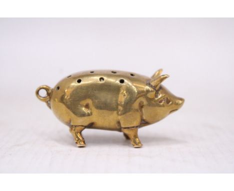 A VINTAGE BRASS PIG PIN CUSHION