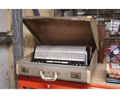 A VINTAGE CASED ACCORDIAN