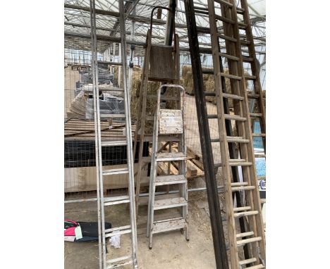 A FOUR RUNG ALUMINIUM STEP LADDER AND A FURTHER WOODEN STEP LADDER