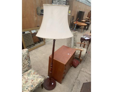 A TURNED COLUMN STANDARD LAMP WITH SHADE