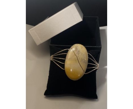 A MARKED 925 BANGLE WITH LARGE JASPER STONE ( NOT CRACKED, IS A NATURAL INCLUSION)