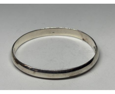 A MARKED SILVER BANGLE