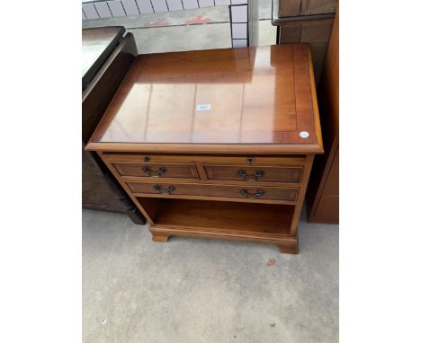 A YEW WOOD SIDE CHEST ENCLOSING THREE DRAWERS, SLIDE AND OPEN SHELF, 23" WIDE