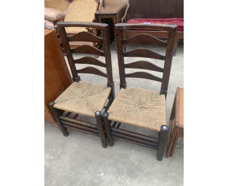 A PAIR OF LANCASHIRE STYLE LADDER BACK CHAIRS WITH RUSH SEATS