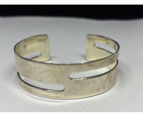 A MARKED SILVER BANGLE