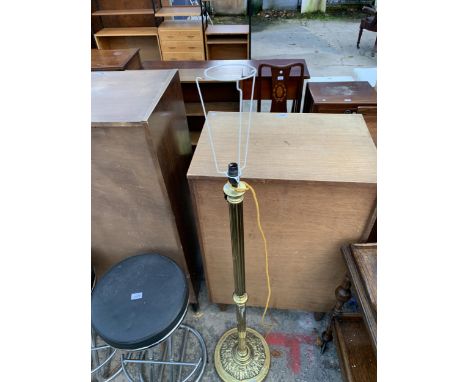 A BRASS STANDARD LAMP WITH FLUTED COLUMN AND EMBOSSED LEAF DECORATION TO BASE
