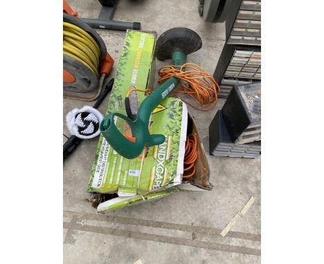 A BLACK AND DECKER ELECTRIC STRIMMER AND A LANDXCAPE ELECTRIC CHAINSAW