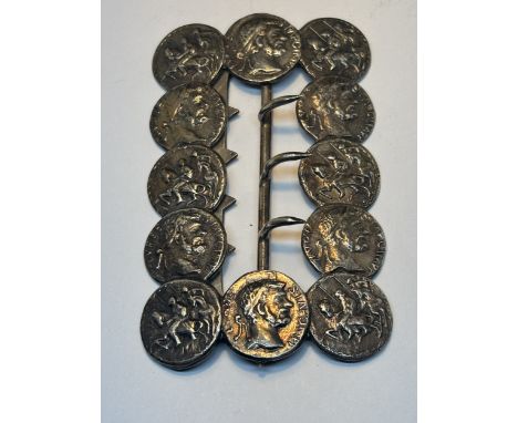 A BUCKLE MADE UP OF VINTAGE COINS