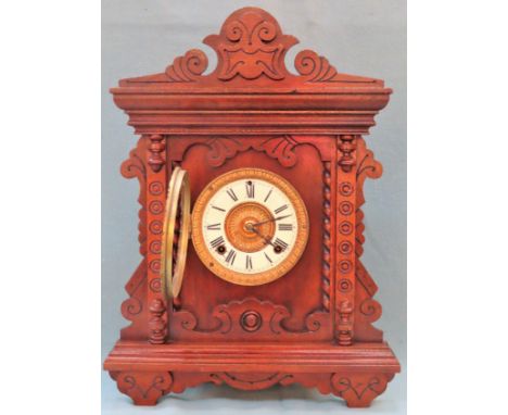Early 20th century carved fronted Oak Ansonia American mantle clock, with circular enamelled dial. App. 47cm H

Used conditio