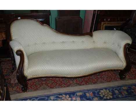 A good Victorian Walnut show frame Salon Sofa with cream ground upholstery, scroll end arm supports and legs with white ceram