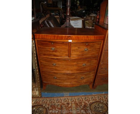 A good 19th c. Mahogany bow fronted Chest of two short over two long graduated, Oak lined Drawers with brass ring handles, on