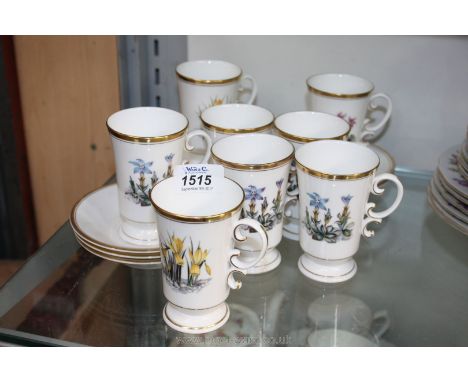 A set of eight Royal Worcester Coffee Mugs and saucers decorated with flowers