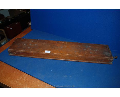 A wooden tabletop string Instrument (as found)