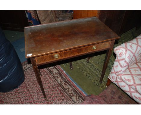 An Edwardian Mahogany Side Table with single frieze drawer with circular plate brass ring handles and string inlay, standing 