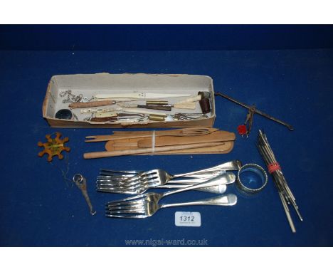 A box of miscellanea including Ivory glove stretchers, button hooks, wooden weaving needles, crochet hooks and six EPNS dinne