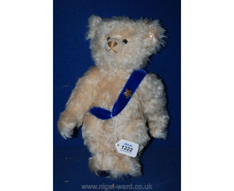 A musical Steiff Teddy Bear with blue velvet sash, 12" tall