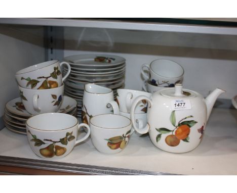 A Royal Worcester 'Evesham' part Breakfast Service including Teapot, Milk Jug, five teacups and saucers, three large teacups 