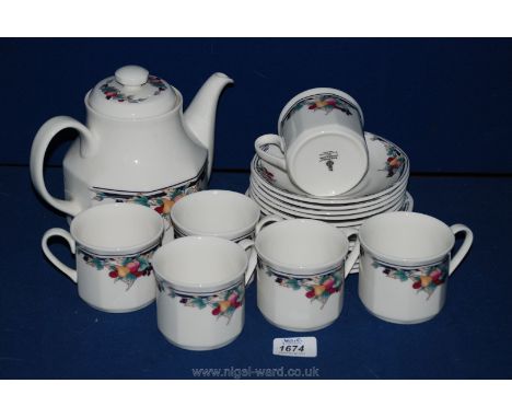 A Royal Doulton 'Autumns Glory' six setting Teaset including cups, saucers, plates and teapot